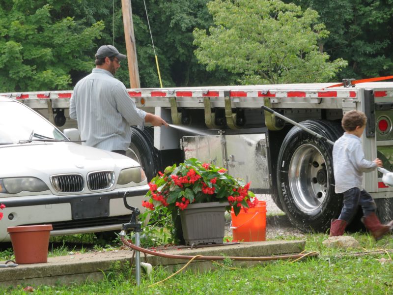 Dad & Son Shining Up the Semi & Trailer