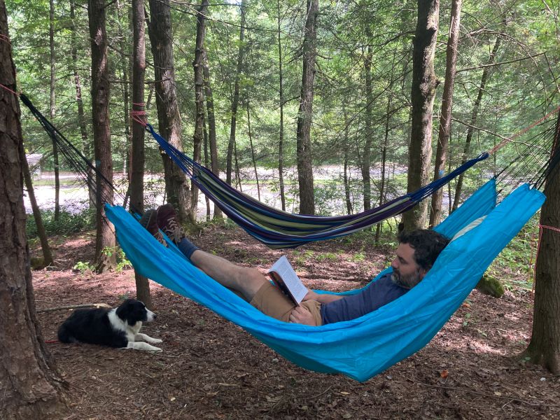 Jack Reading with Conwy on a Camping Trip