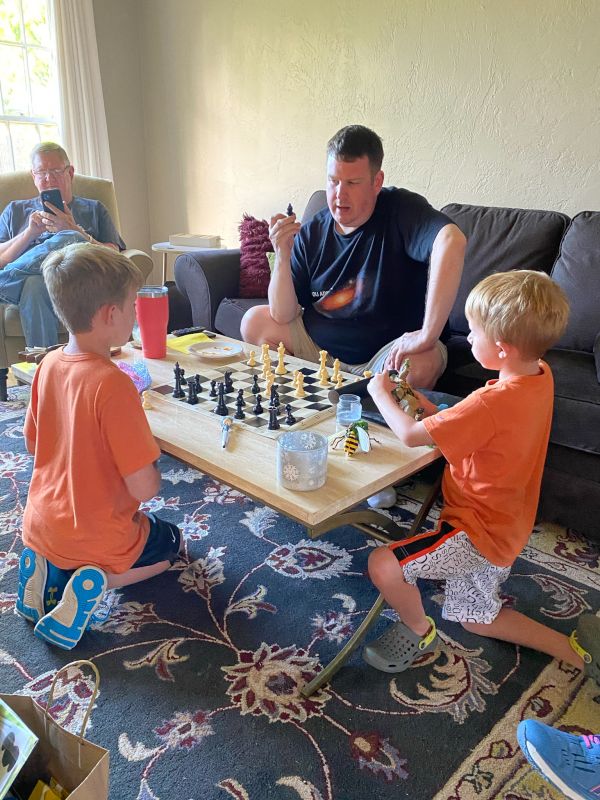 Peter Teaching Our Nephews Chess